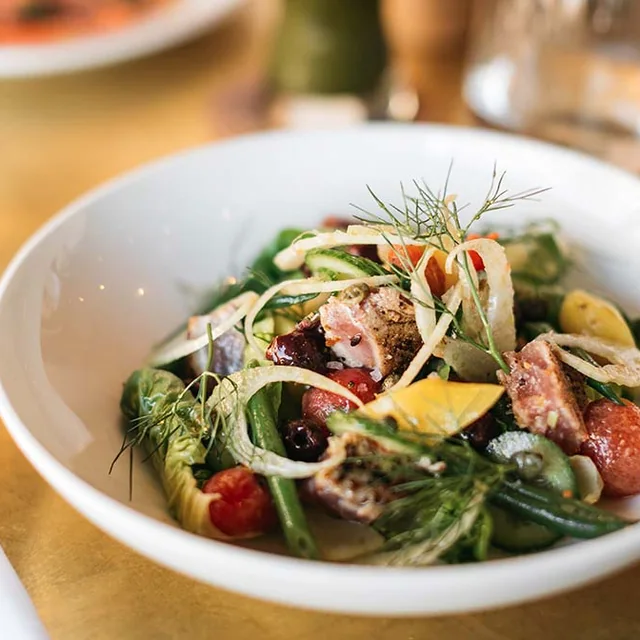 A bright composed salad with salmon and shaved vegetables at Knox Bistro