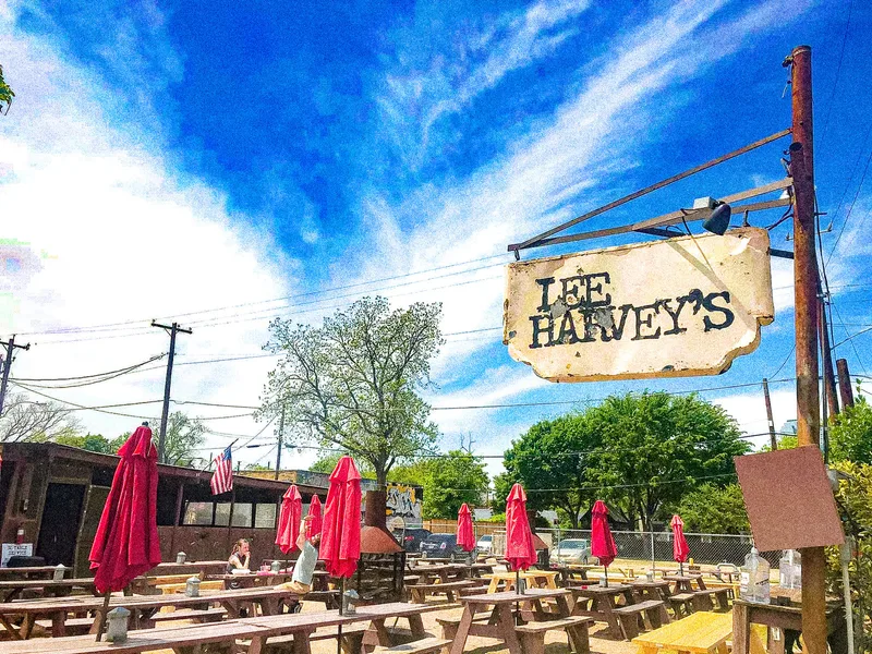 Lee Harvey’s hanging sign over the picnic-table beer yard