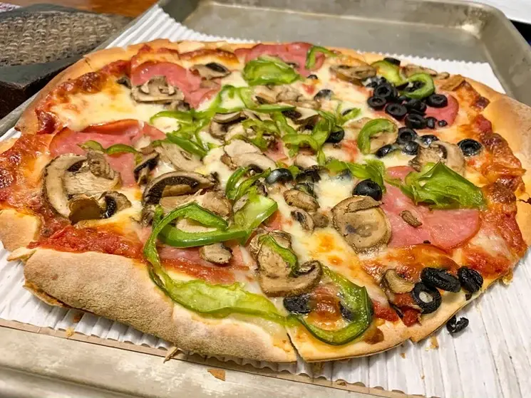 A fully loaded pizza from Louie’s