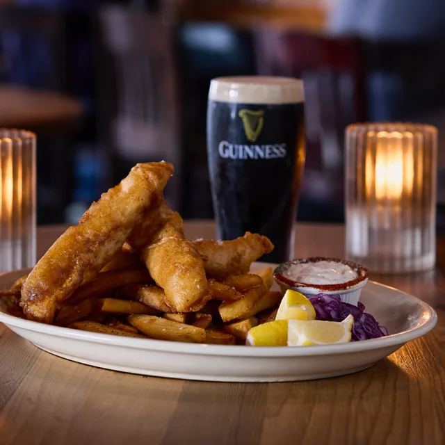 Fish and chips with a pint of Guinness at The Old Monk