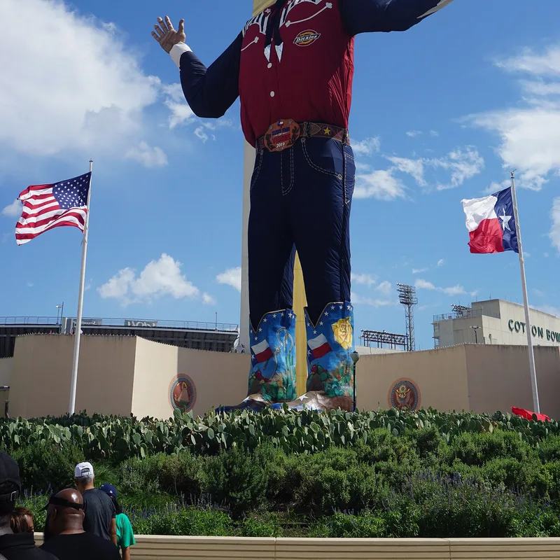 Big Tex towering over the State Fair of Texas midway at Fair Park