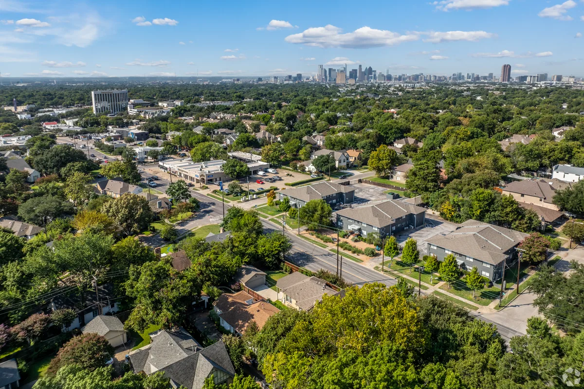Aerial view of the community in leafy East Dallas with the downtown skyline on the horizon